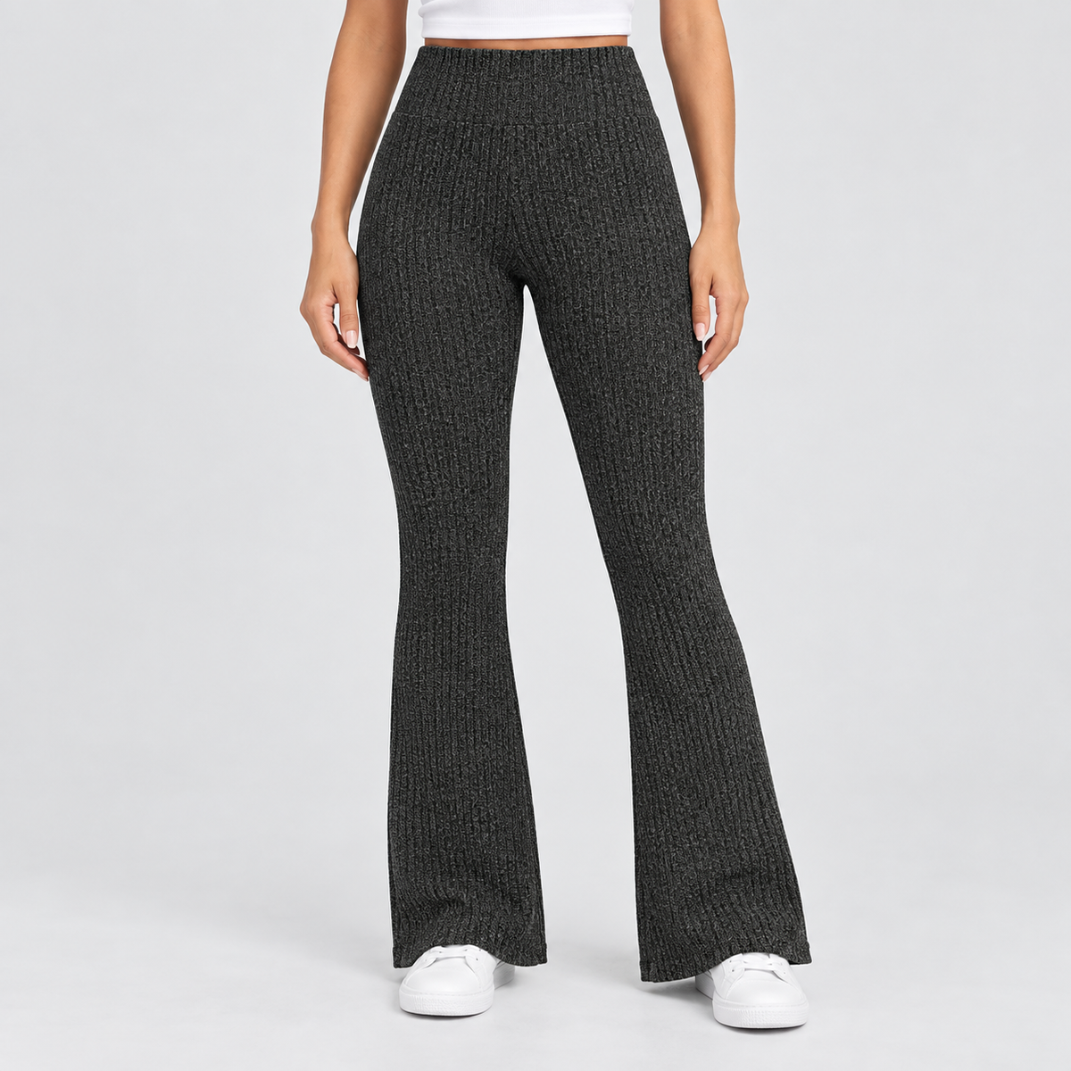 High Waisted Ribbed Knit Flare Yoga Pants in Black, worn on a model.