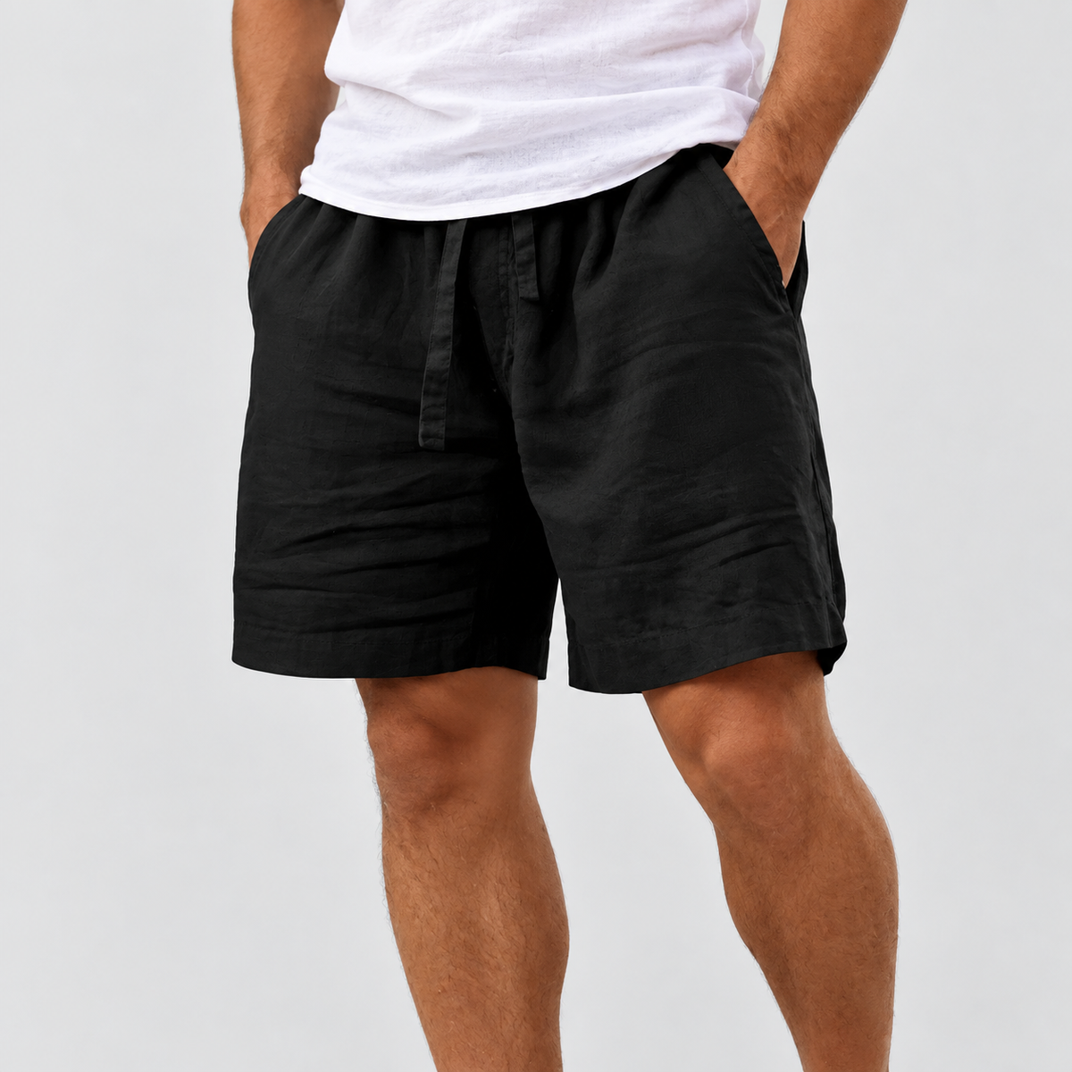 Relaxed Fit Drawstring Shorts in Black, worn on a model.