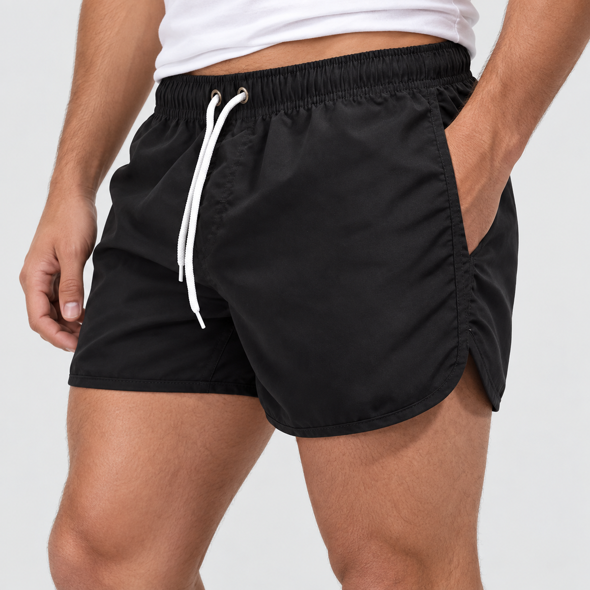 Relaxed Fit Drawstring Swim Shorts in Black, worn on a model.