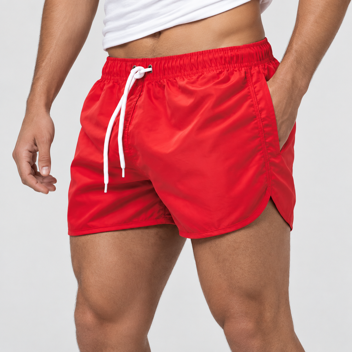 Relaxed Fit Drawstring Swim Shorts in Red, worn on a model.