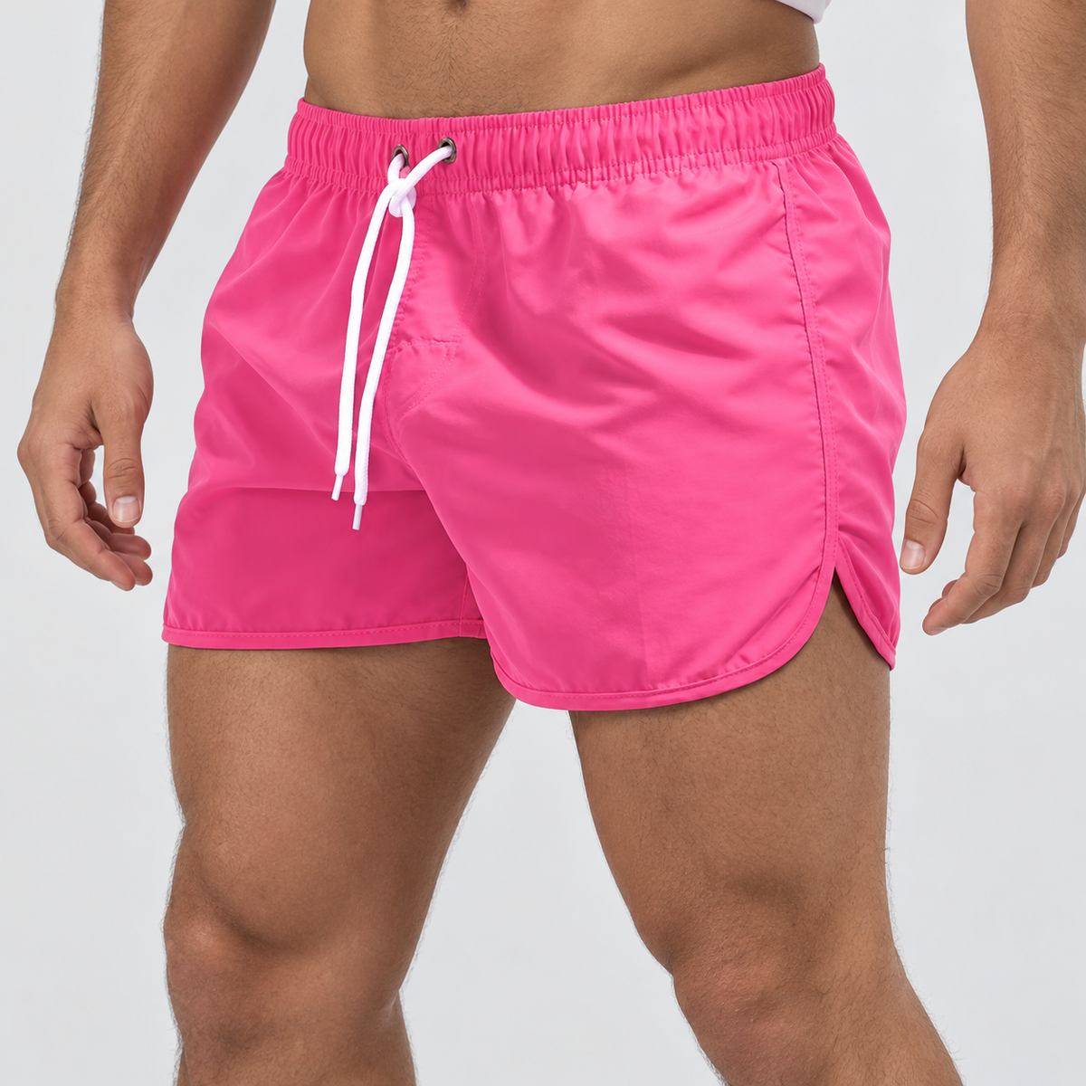 Relaxed Fit Drawstring Swim Shorts in Pink, worn on a model.