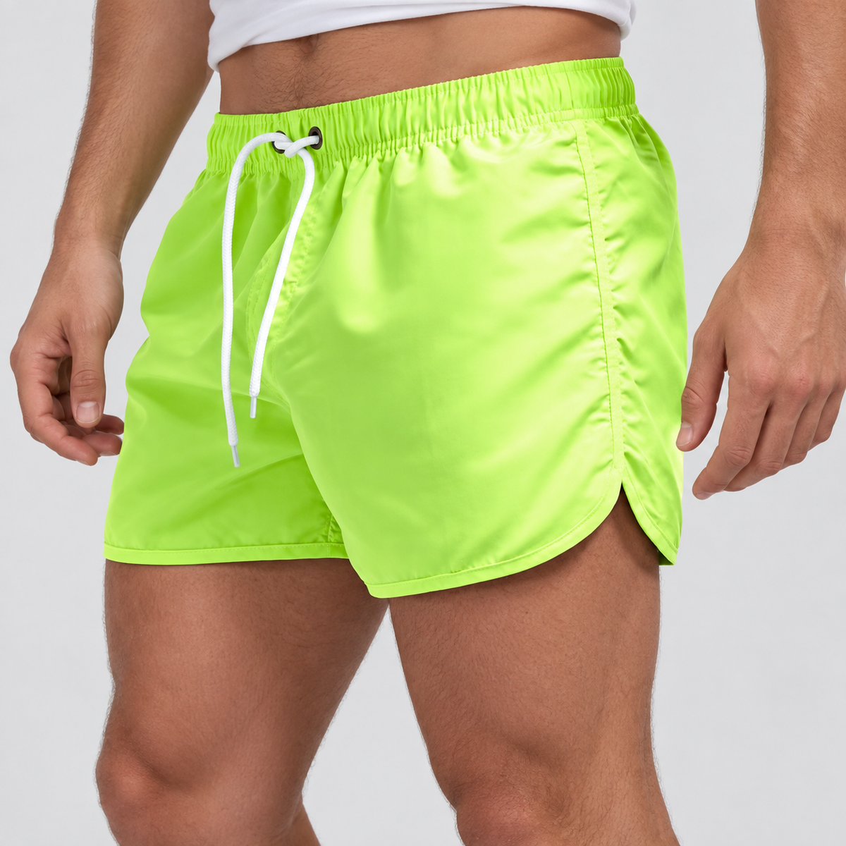 Relaxed Fit Drawstring Swim Shorts in Green, worn on a model.