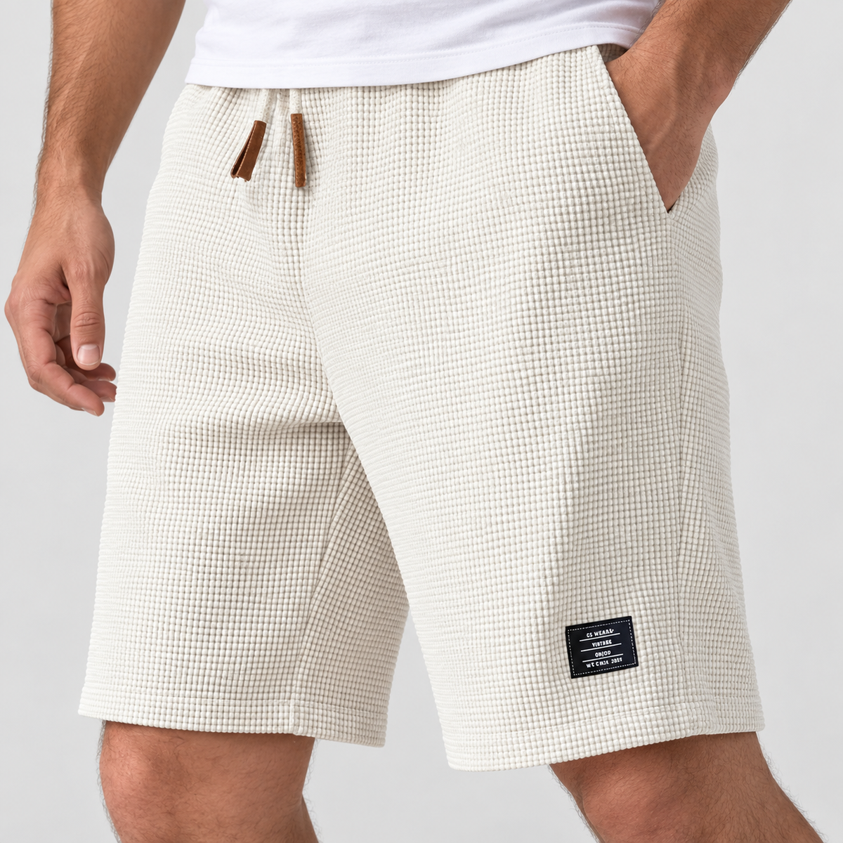 Relaxed Fit Waffle Texture Drawstring Shorts in Off white, worn on a model.