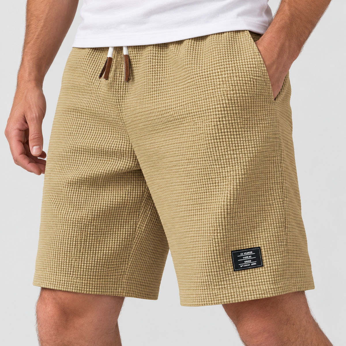 Relaxed Fit Waffle Texture Drawstring Shorts in Khaki, worn on a model.