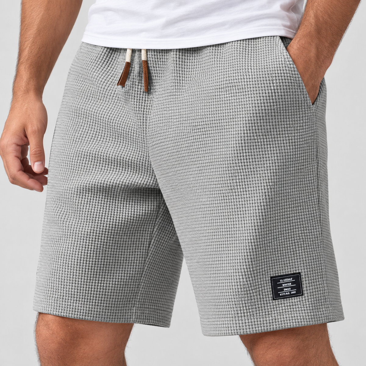 Relaxed Fit Waffle Texture Drawstring Shorts in Grey, worn on a model.