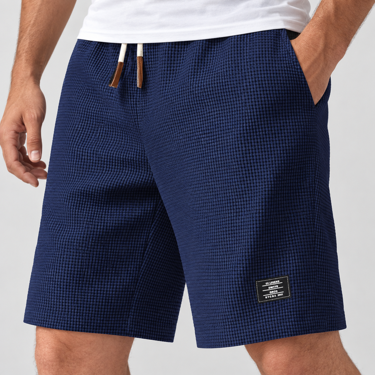 Relaxed Fit Waffle Texture Drawstring Shorts in Dark Blue, worn on a model.