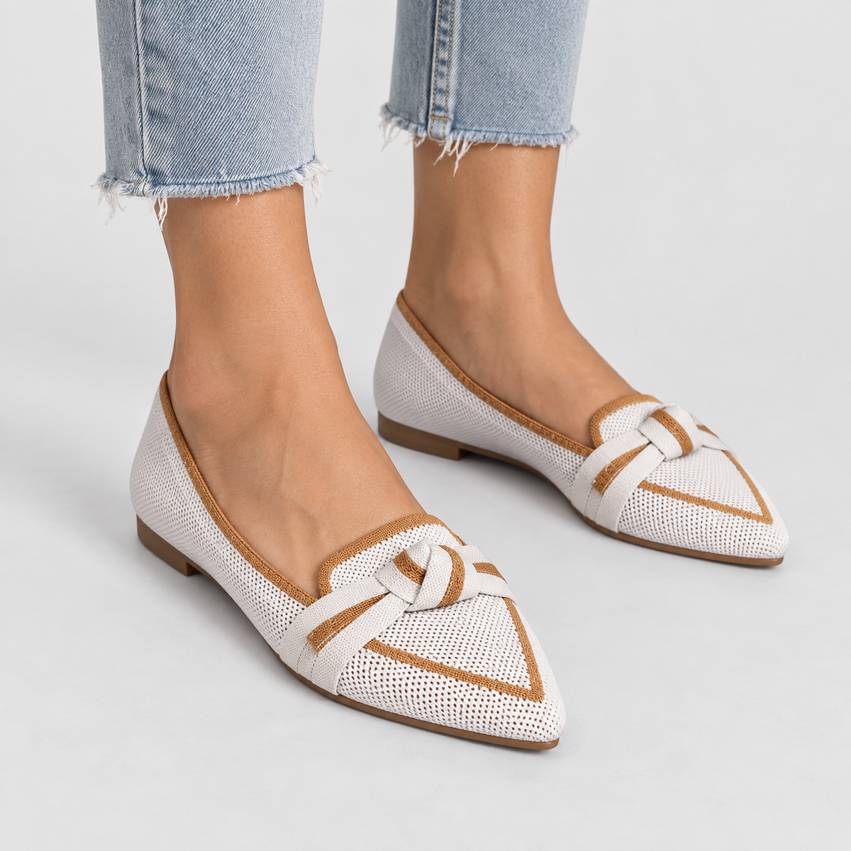 Pointed Toe Knit Ballet Flats with Bow Detail in White, worn on a model.