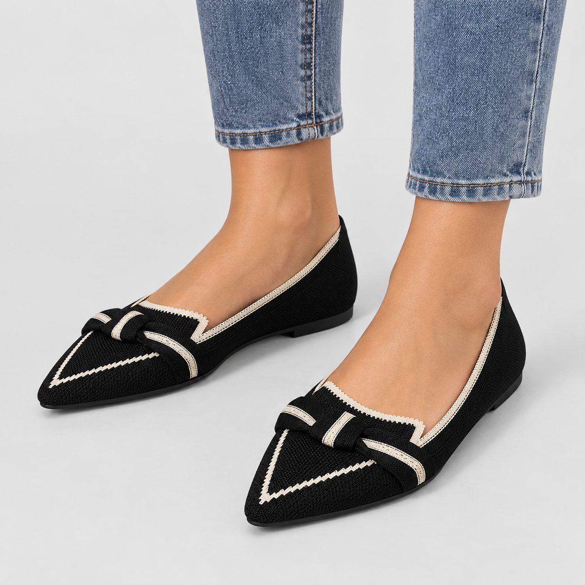 Pointed Toe Knit Ballet Flats with Bow Detail in Black, worn on a model.