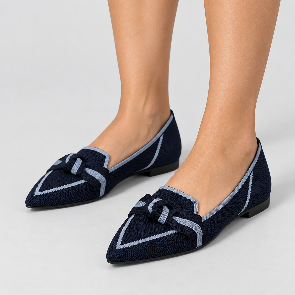 Pointed Toe Knit Ballet Flats with Bow Detail, worn on a model.