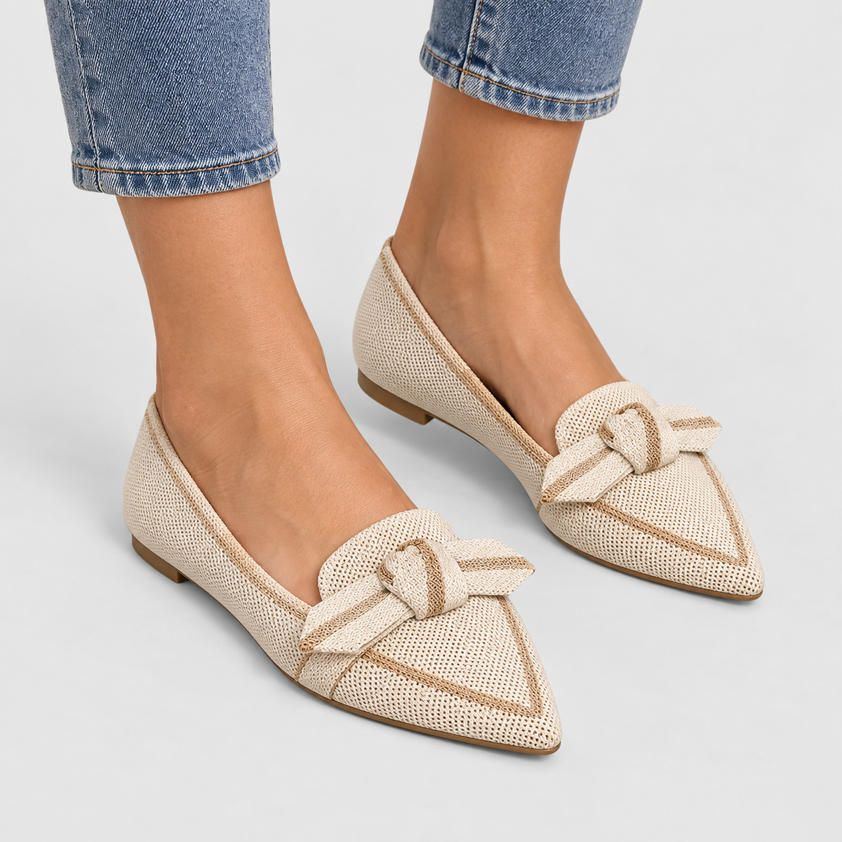 Pointed Toe Knit Ballet Flats with Bow Detail in Beige, worn on a model.
